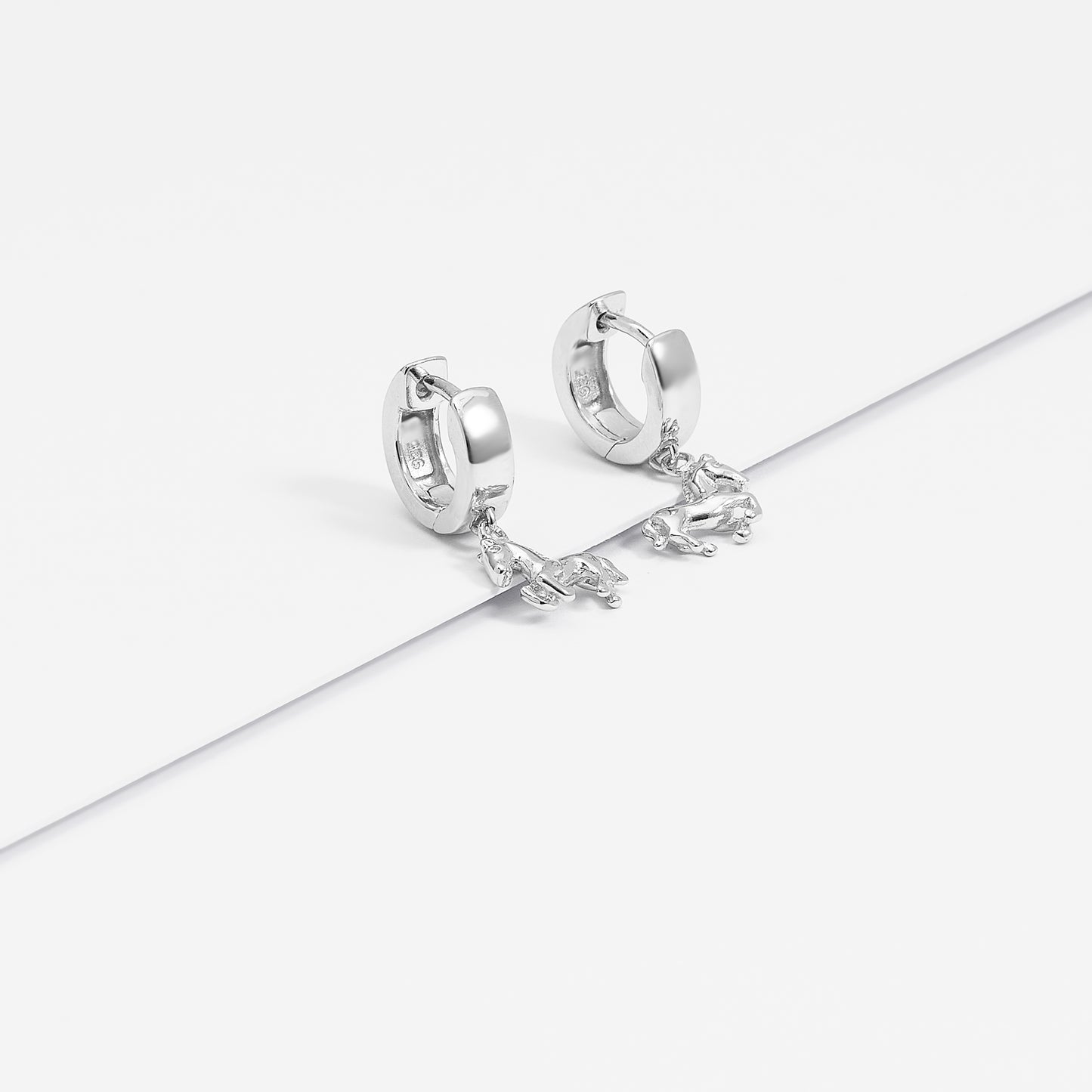 Sterling Silver Huggie Earrings With Dangling Horse