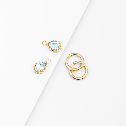 9K Yellow Gold Huggie Earrings With Dangling Blue Topaz Pear