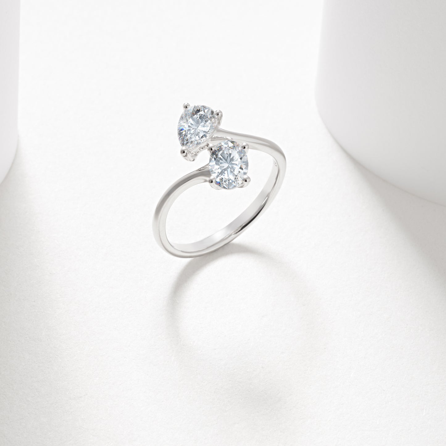 9w 0.7ct oval and pear cut lab diamond claw set toi et moi ring