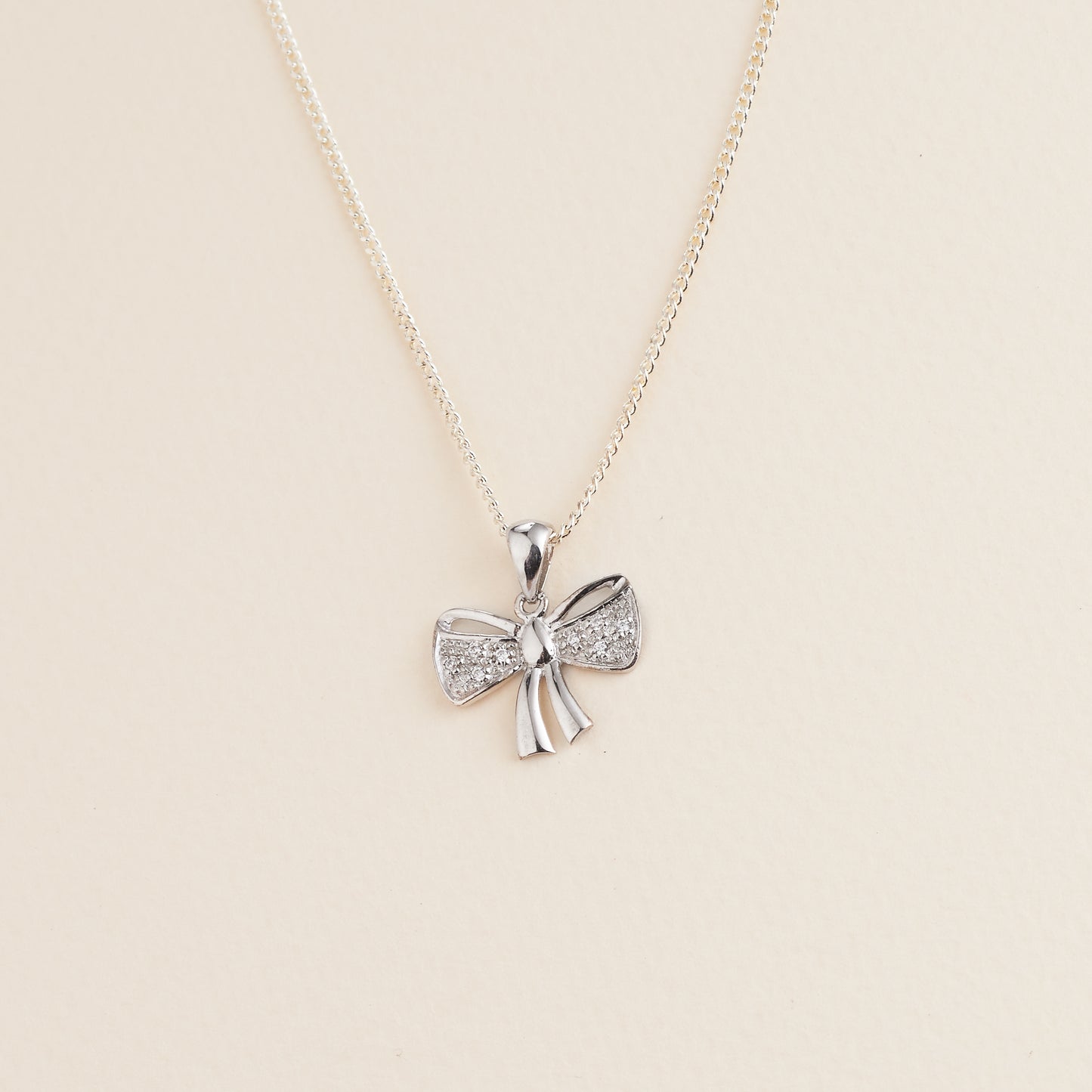 Sterling Silver Zirconia Bow Pendant