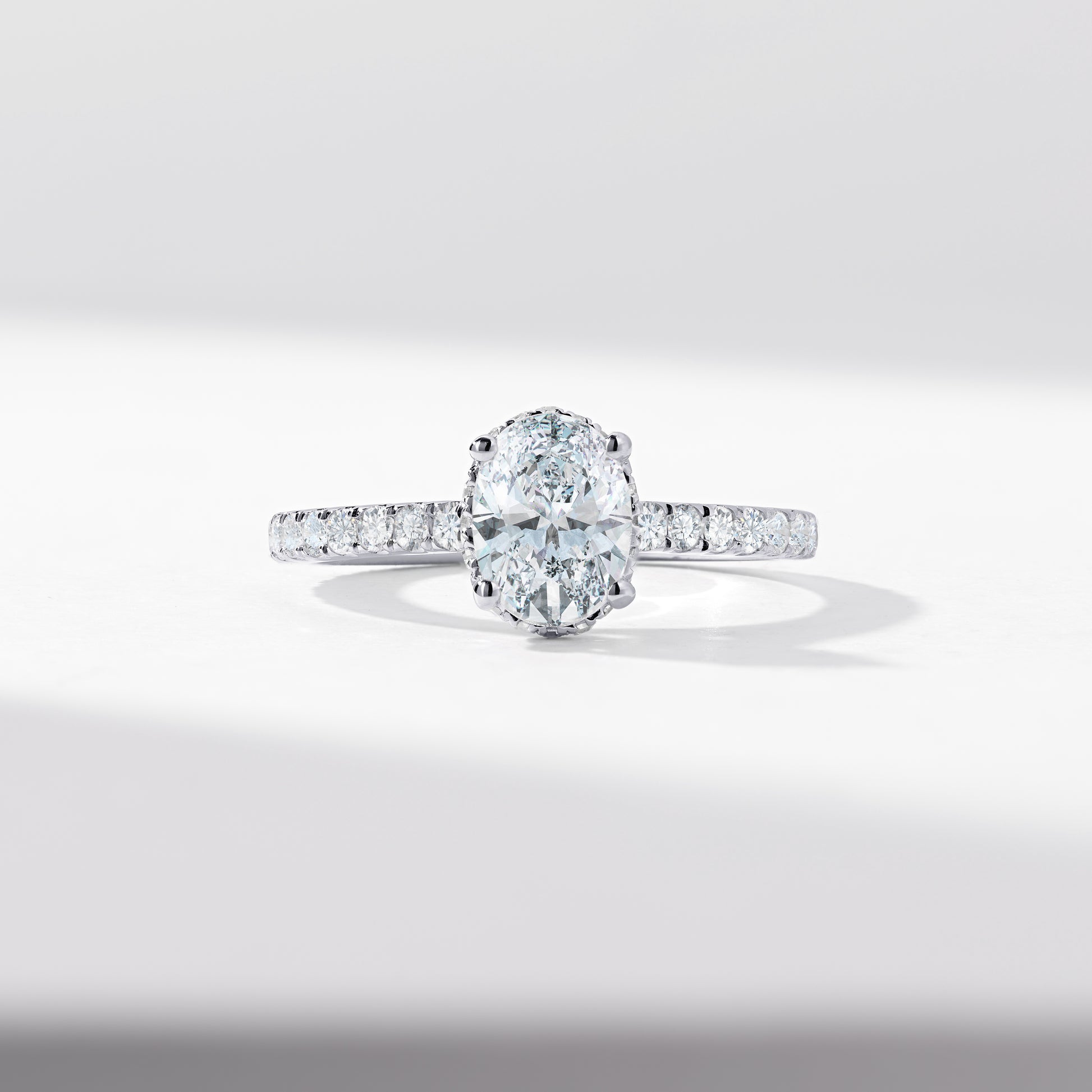 Oval Diamond Solitaire With Diamond Hidden Halo And