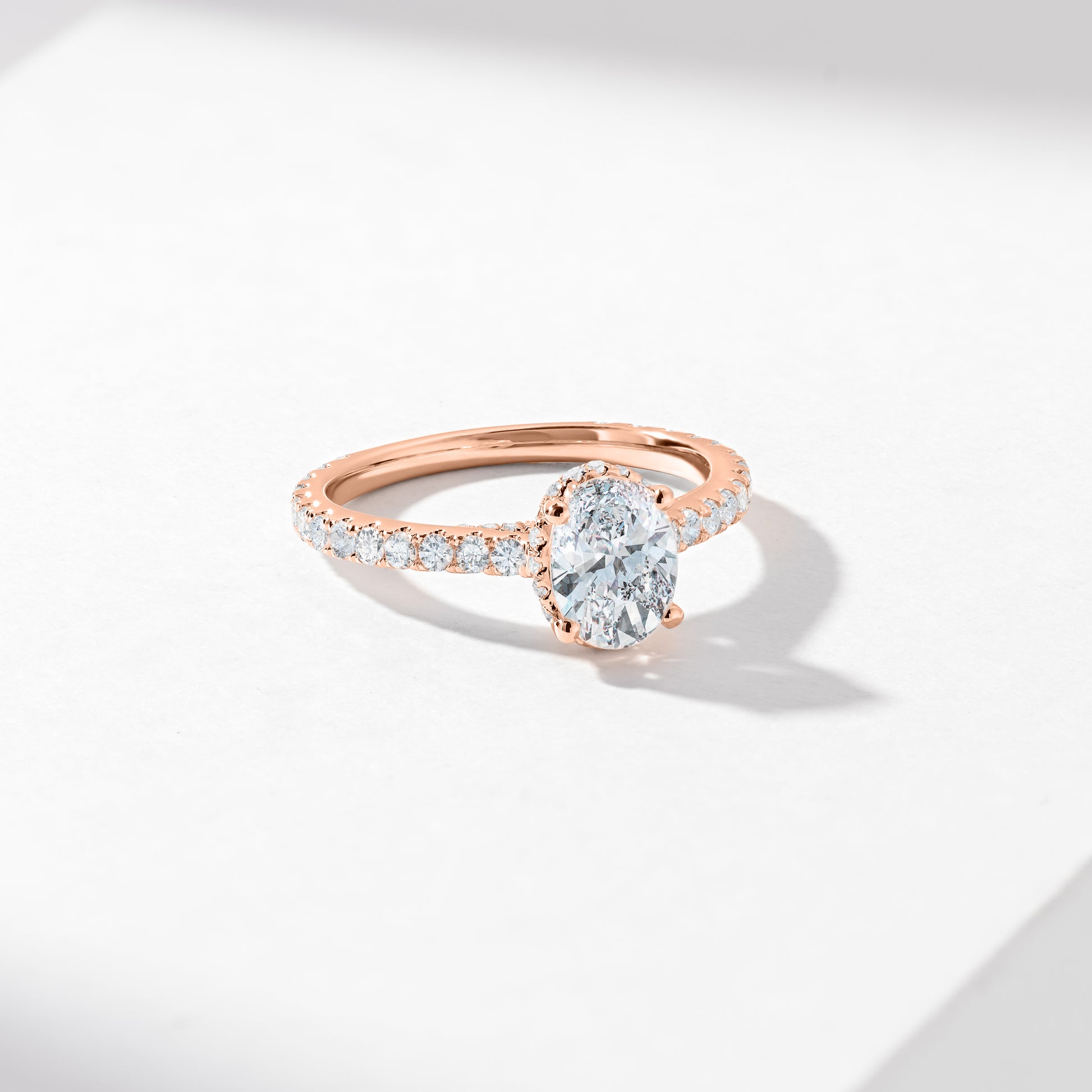 Oval Diamond Solitaire With Diamond Hidden Halo And