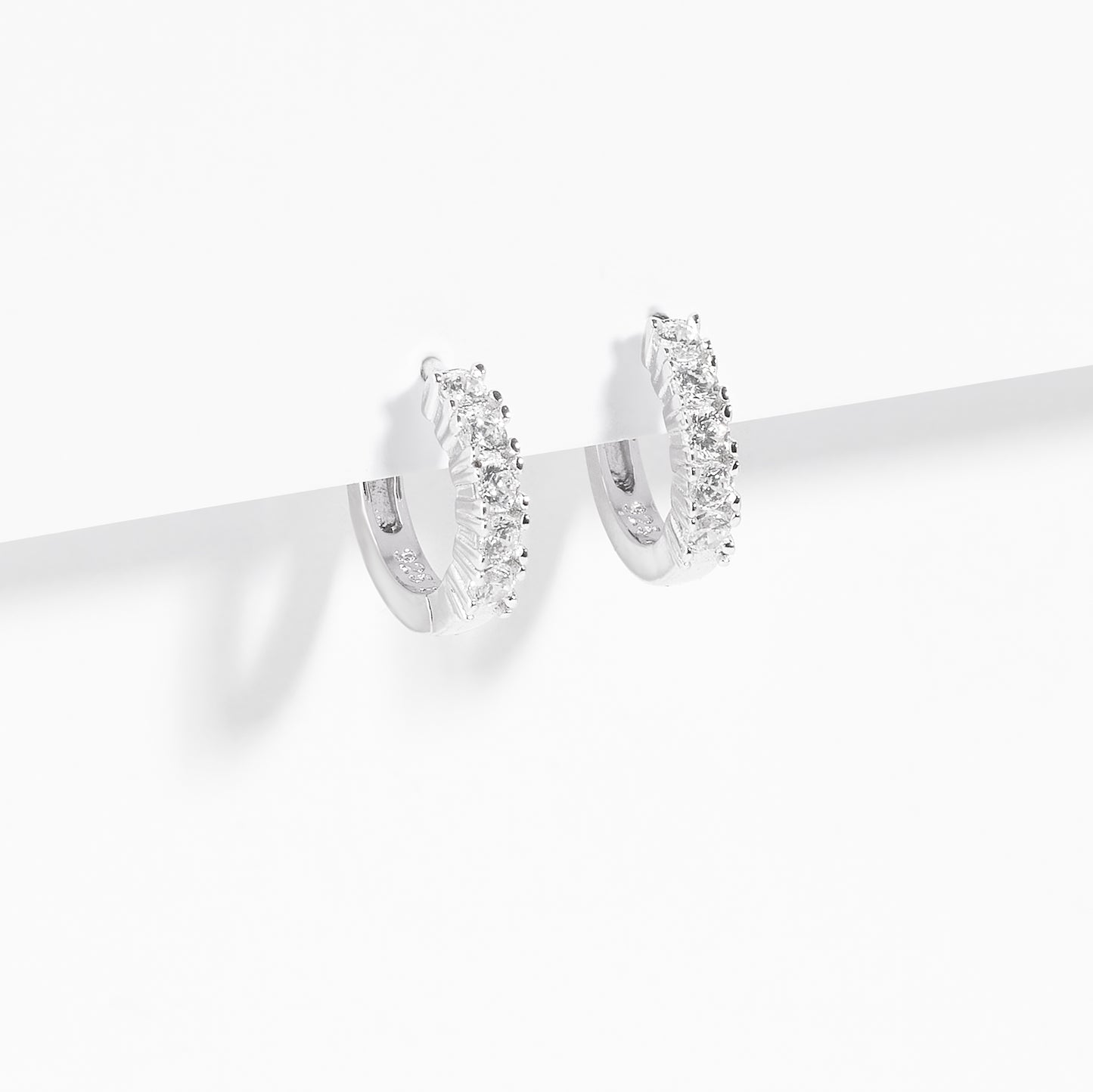 Sterling Silver Zirconia Claw Set Huggie Earrings – Simon Curwood