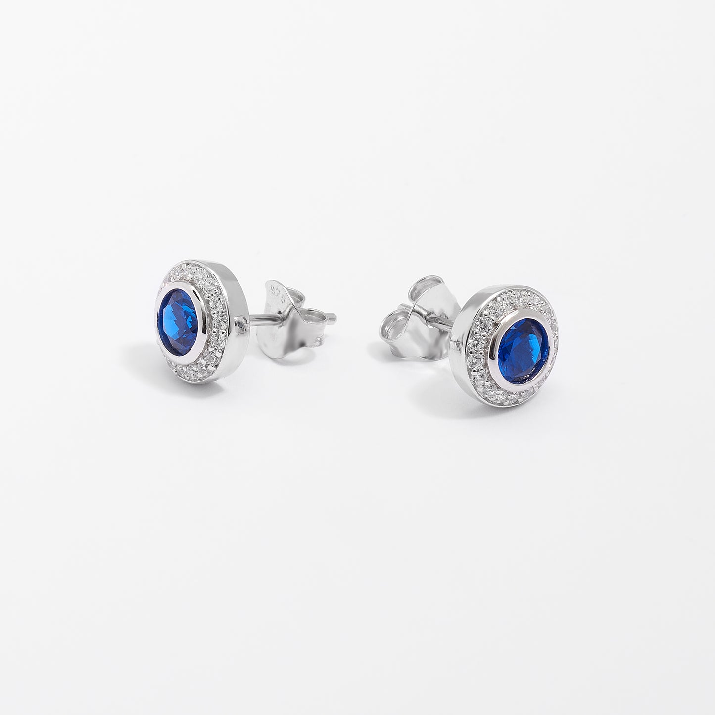 Sterling Silver Bezel Royal Blue Zirconia And Halo Stud Earrings