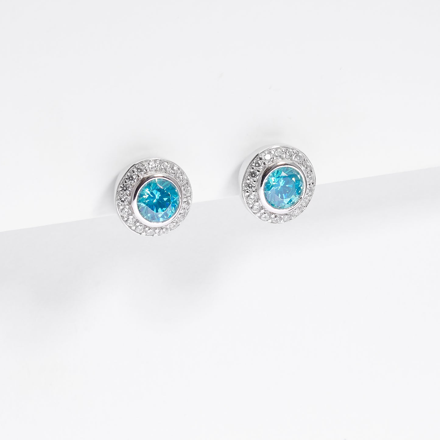 Sterling Silver Bezel Aqua Green Zirconia And Halo Stud Earrings