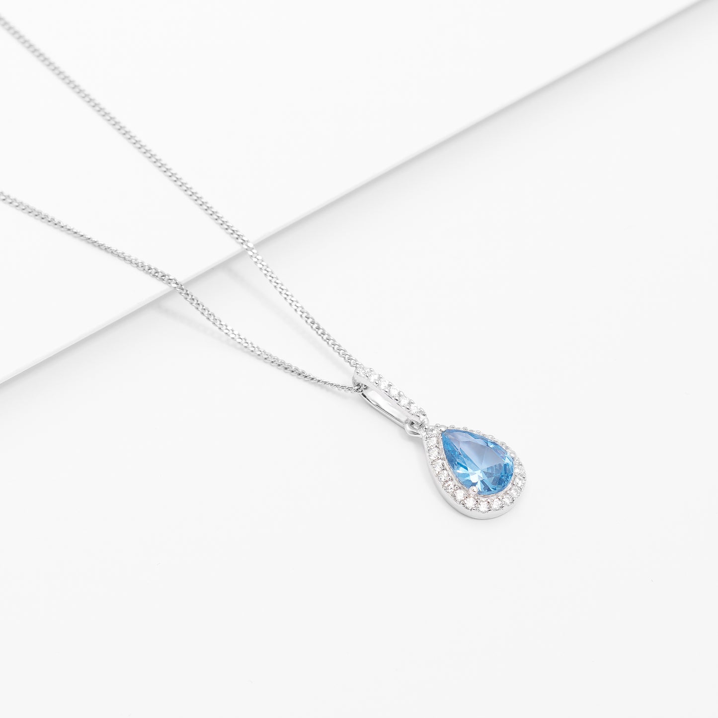 Sterling Silver Pale Blue Pear Zirconia Halo Pendant