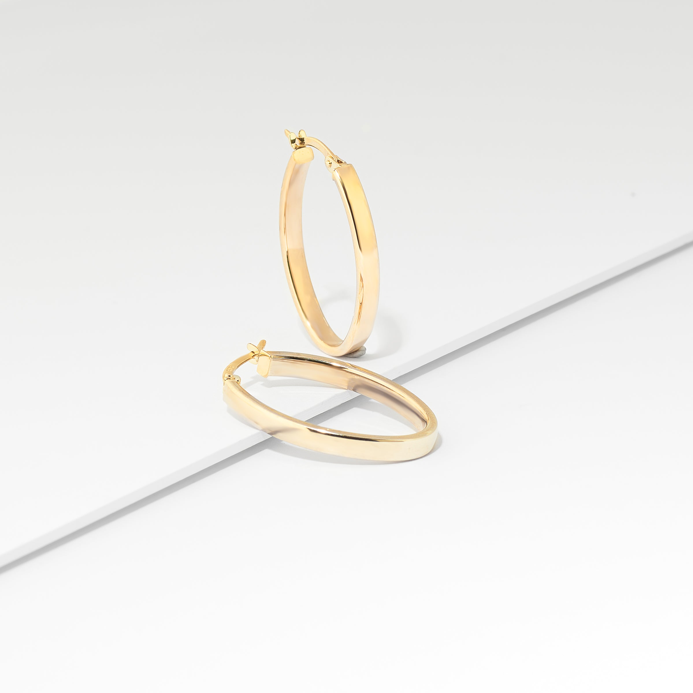 9K Yellow Gold Oval Hoop Earrings 25mm