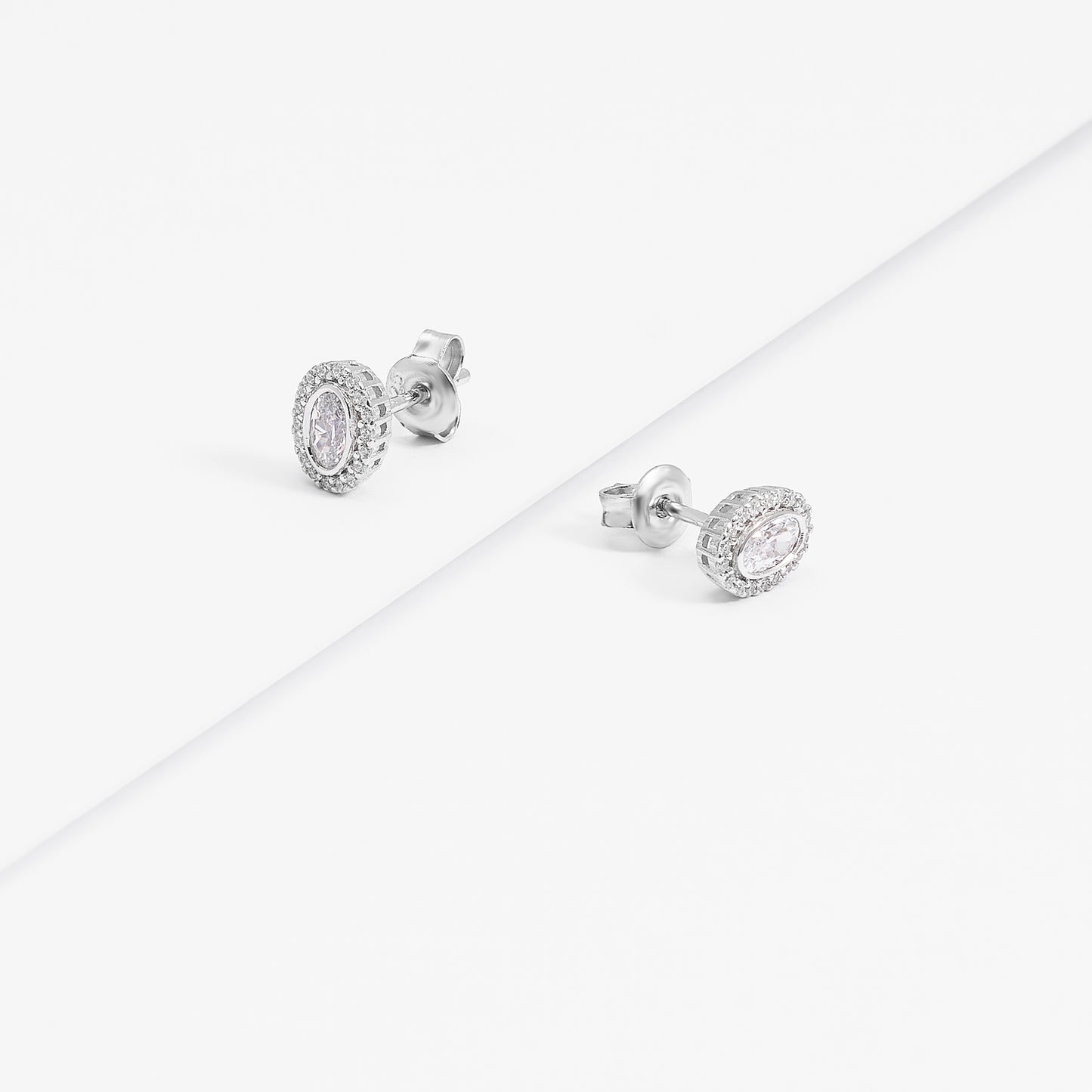 Sterling Silver Bezel Oval Zirconia Halo Stud Earrings