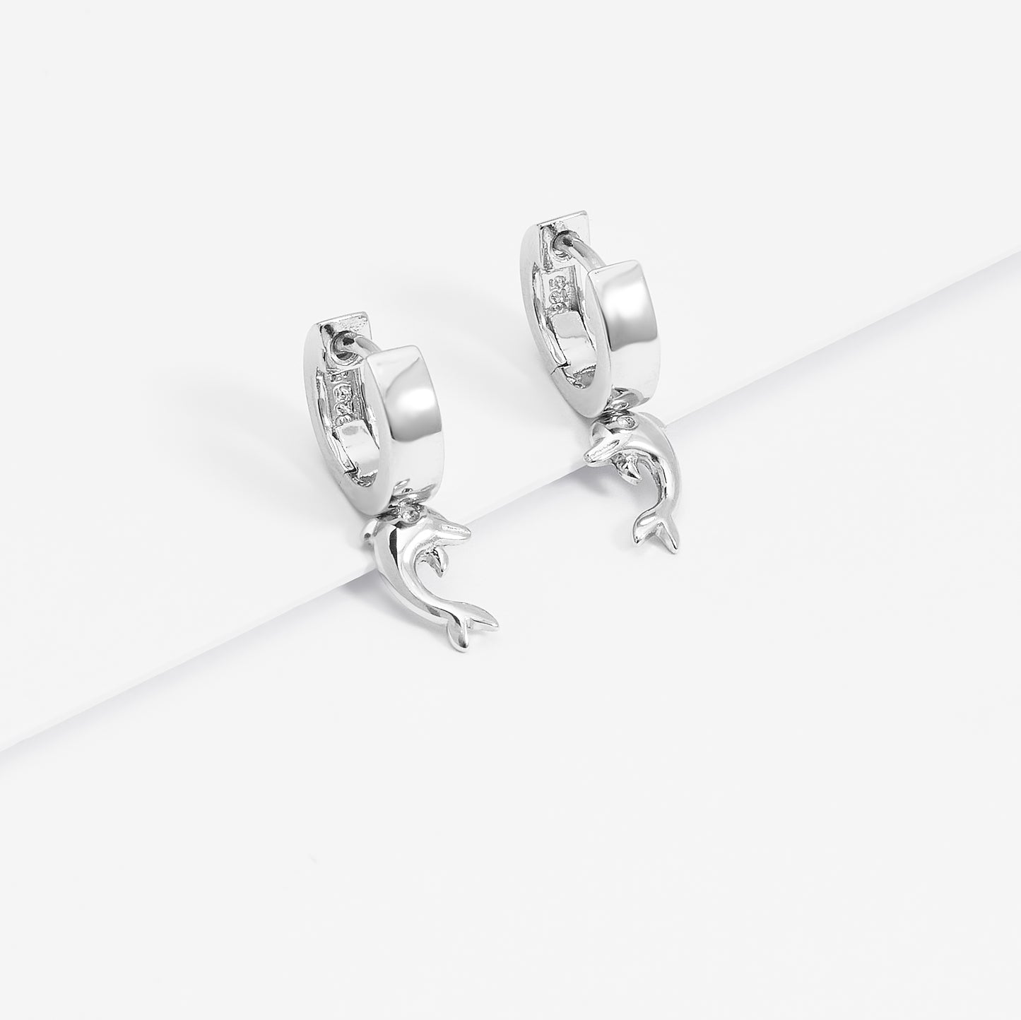 Sterling Silver Huggie Earrings With Dangling Dolphin