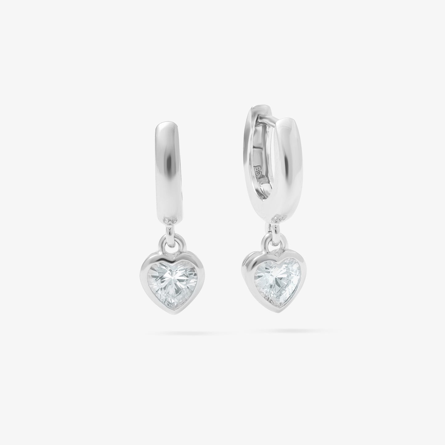 Sterling Silver Huggie Earrings With Dangling Zirconia Heart