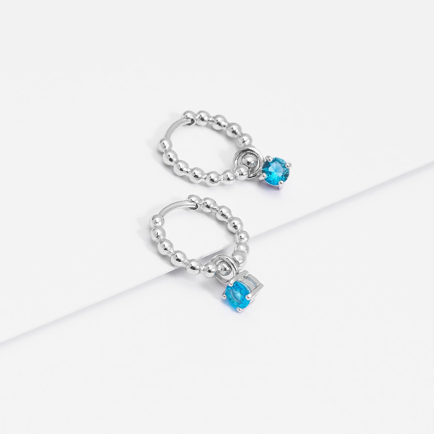 Sterling Silver Beaded Huggie Earrings With Blue Zirconia December Birthstone Drop