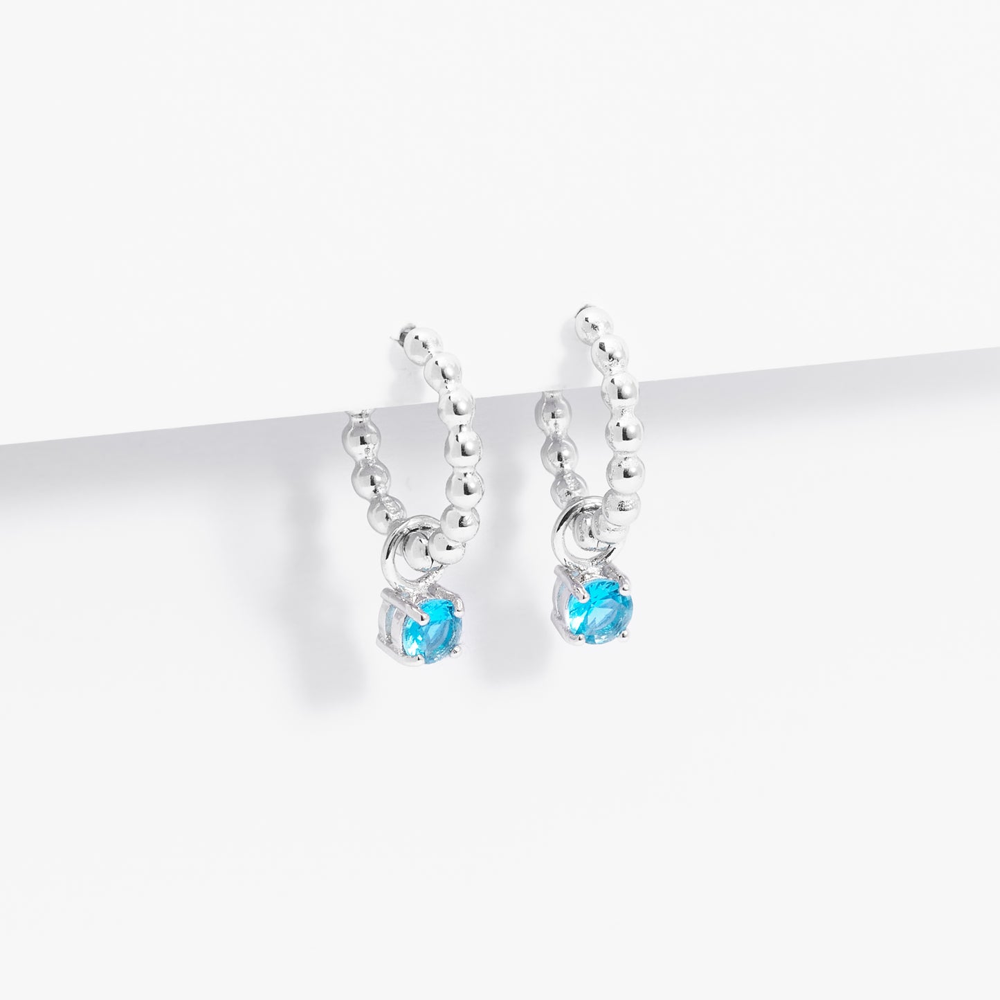 Sterling Silver Beaded Huggie Earrings With Blue Zirconia December Birthstone Drop