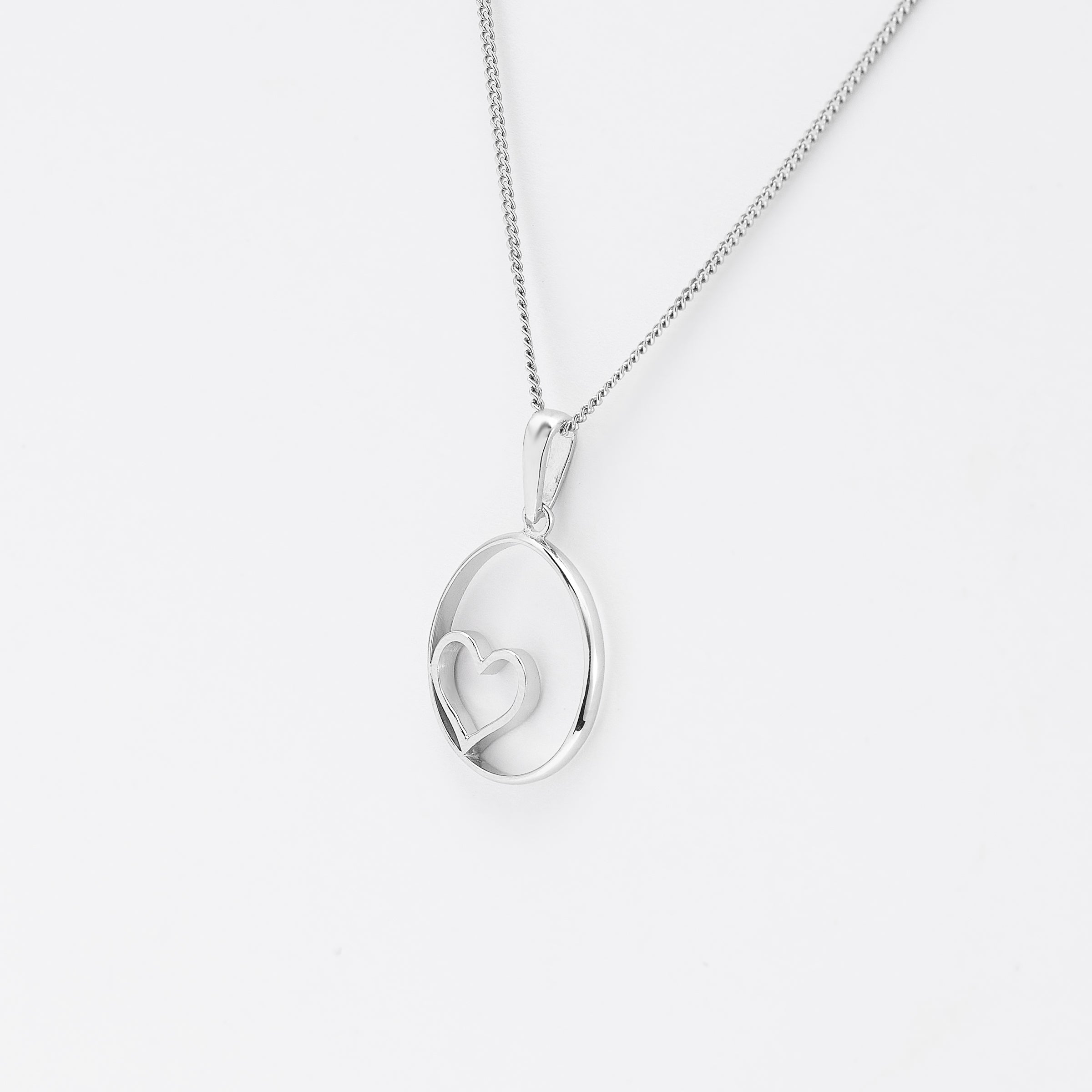 Sterling Silver Open Circle With Heart Pendant