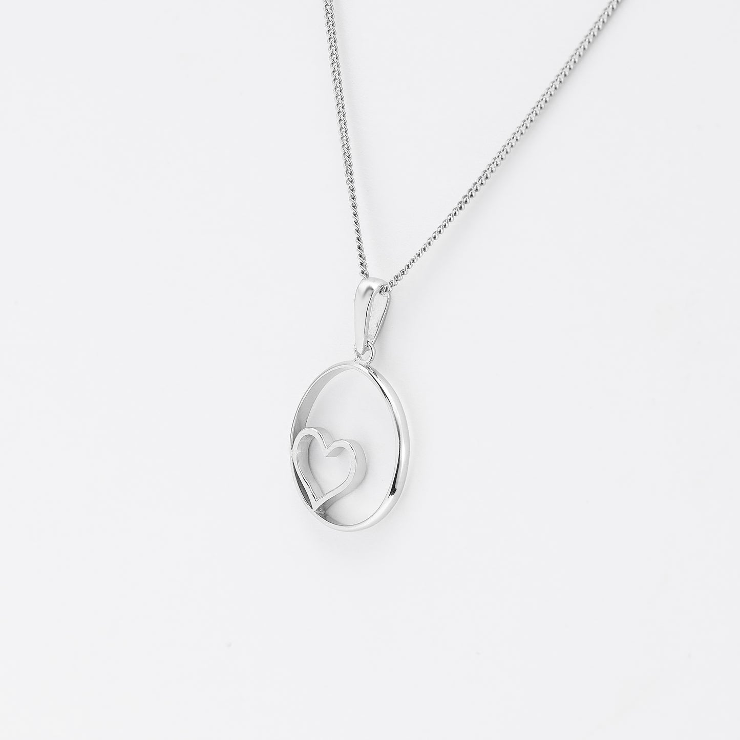 Sterling Silver Open Circle With Heart Pendant