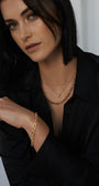 Model wearing the 9K yellow gold alternating oval and round link chain and matching bracelet