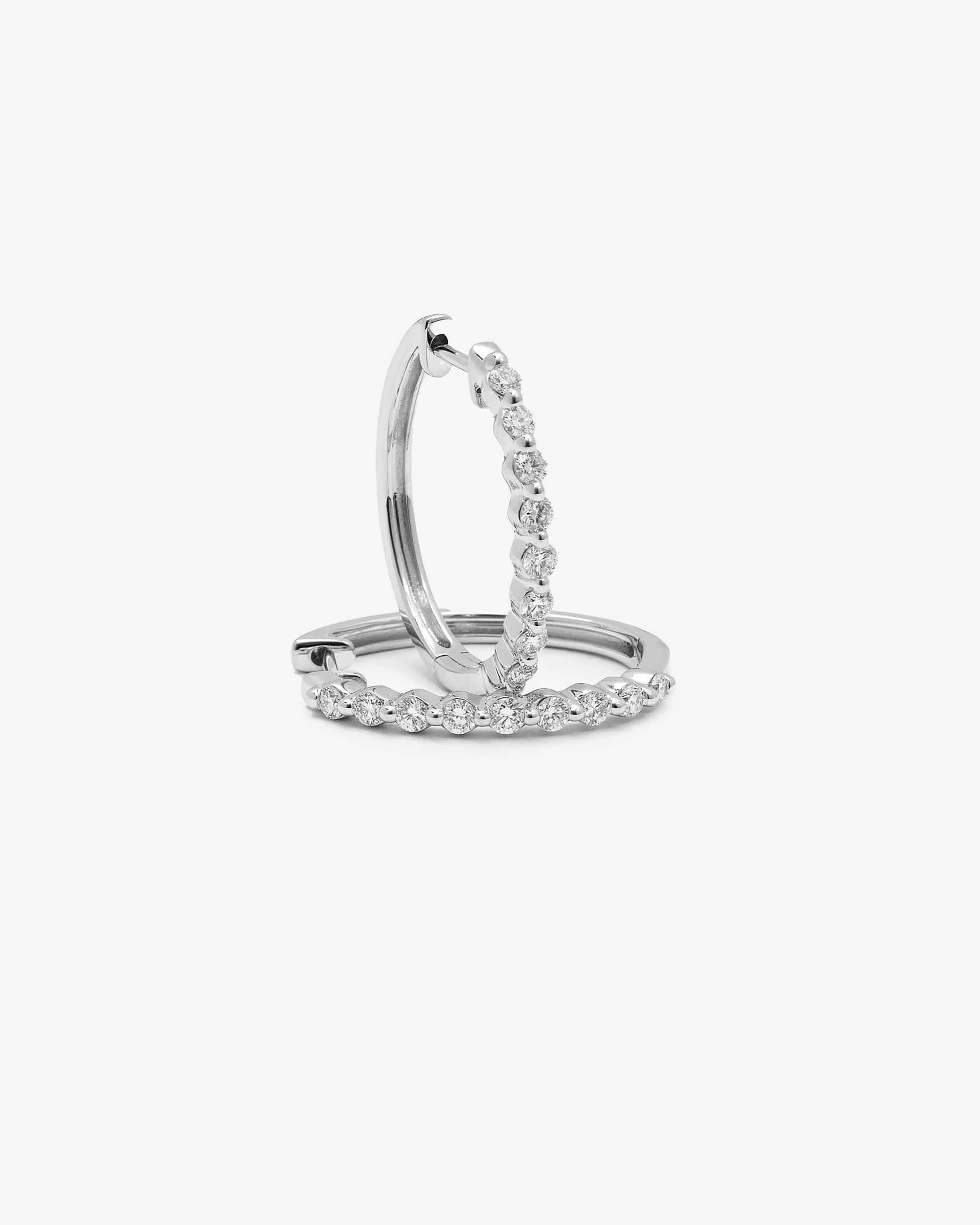 9K White Gold Round Brilliant Floating Lab Diamond Oval Huggie Earrings 0.5tdw