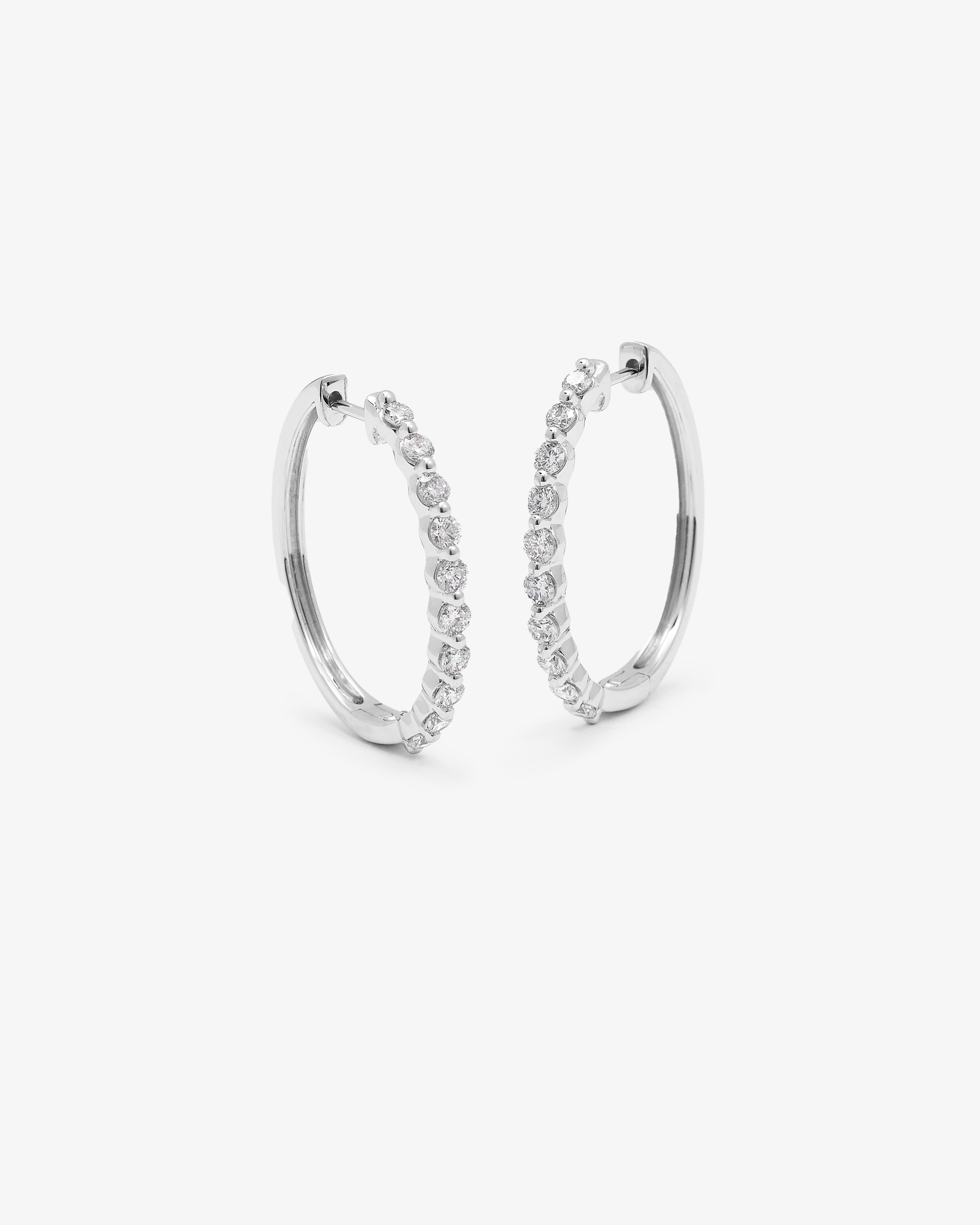9K White Gold Round Brilliant Floating Lab Diamond Oval Huggie Earrings 1.0tdw