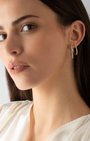 9K Yellow Gold Round Brilliant Floating Lab Diamond Oval Huggie Earrings 0.5tdw model shot