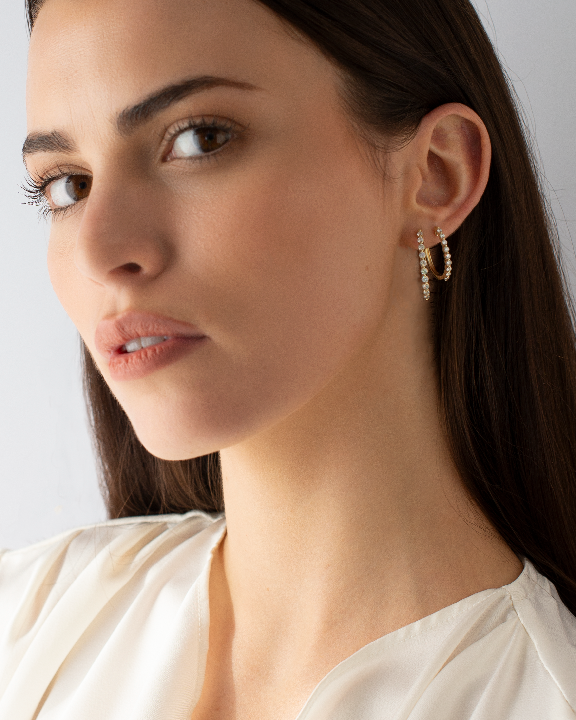 9K Yellow Gold Round Brilliant Floating Lab Diamond Oval Huggie Earrings 0.5tdw model shot