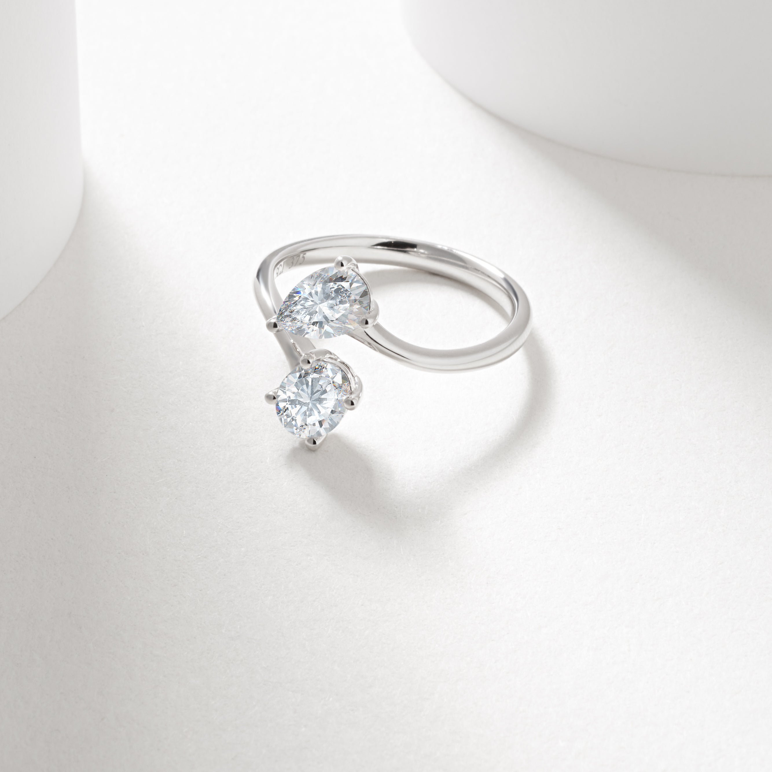 9w 0.7ct oval and pear cut lab diamond claw set toi et moi ring