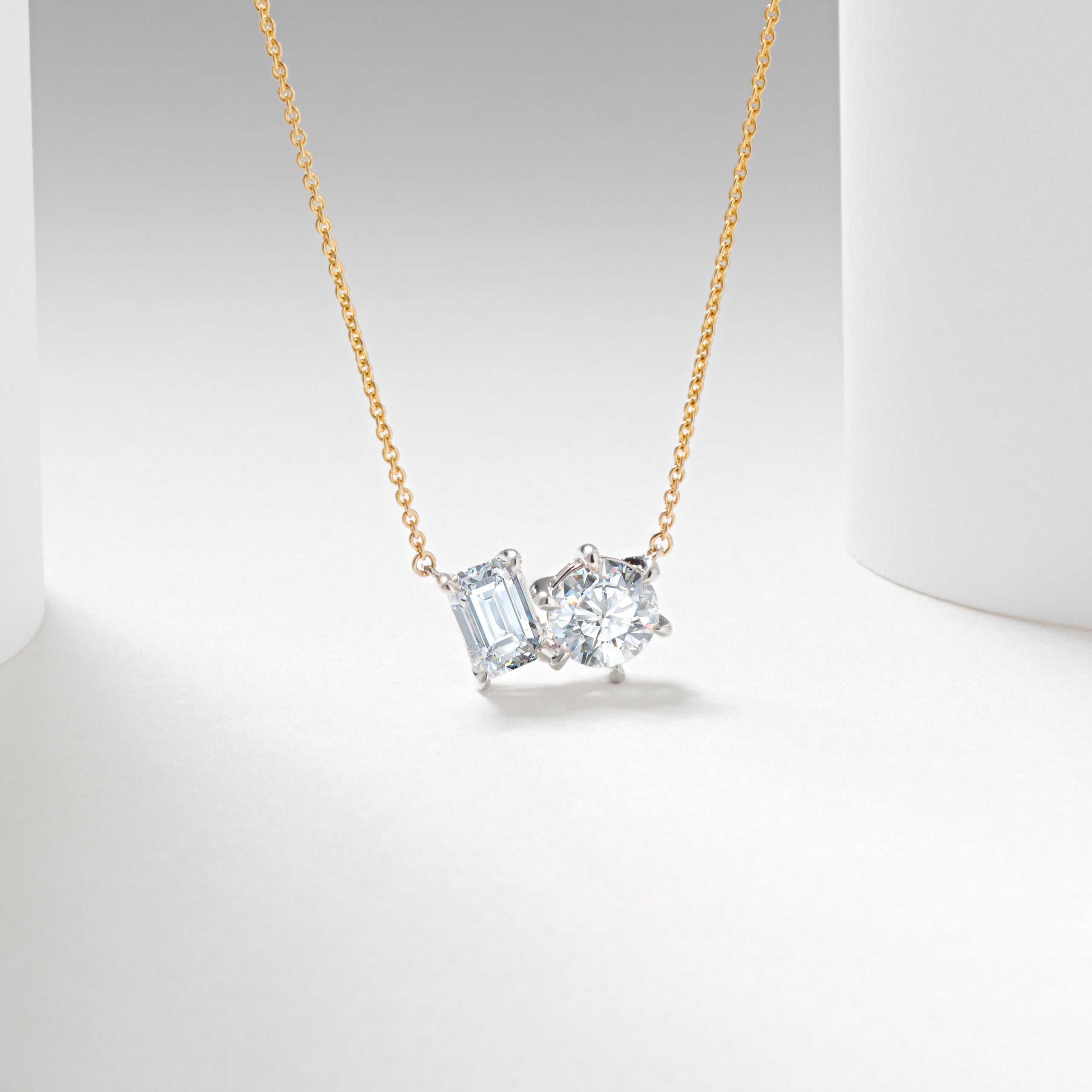 9WY 1.53tdw emerald and round lab diamond claw set toi et moi pendant and chain 45cm