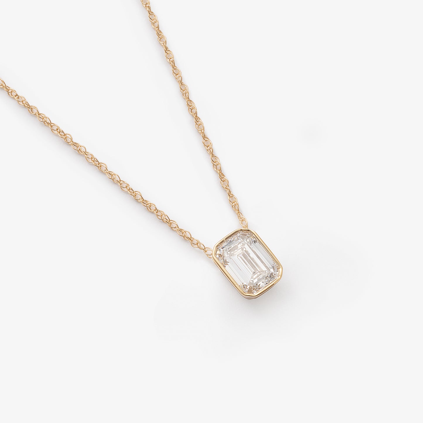 9K Yellow Gold 0.70ct Bezel Emerald Cut Lab Diamond Slider Pendant With Chain 45cm.