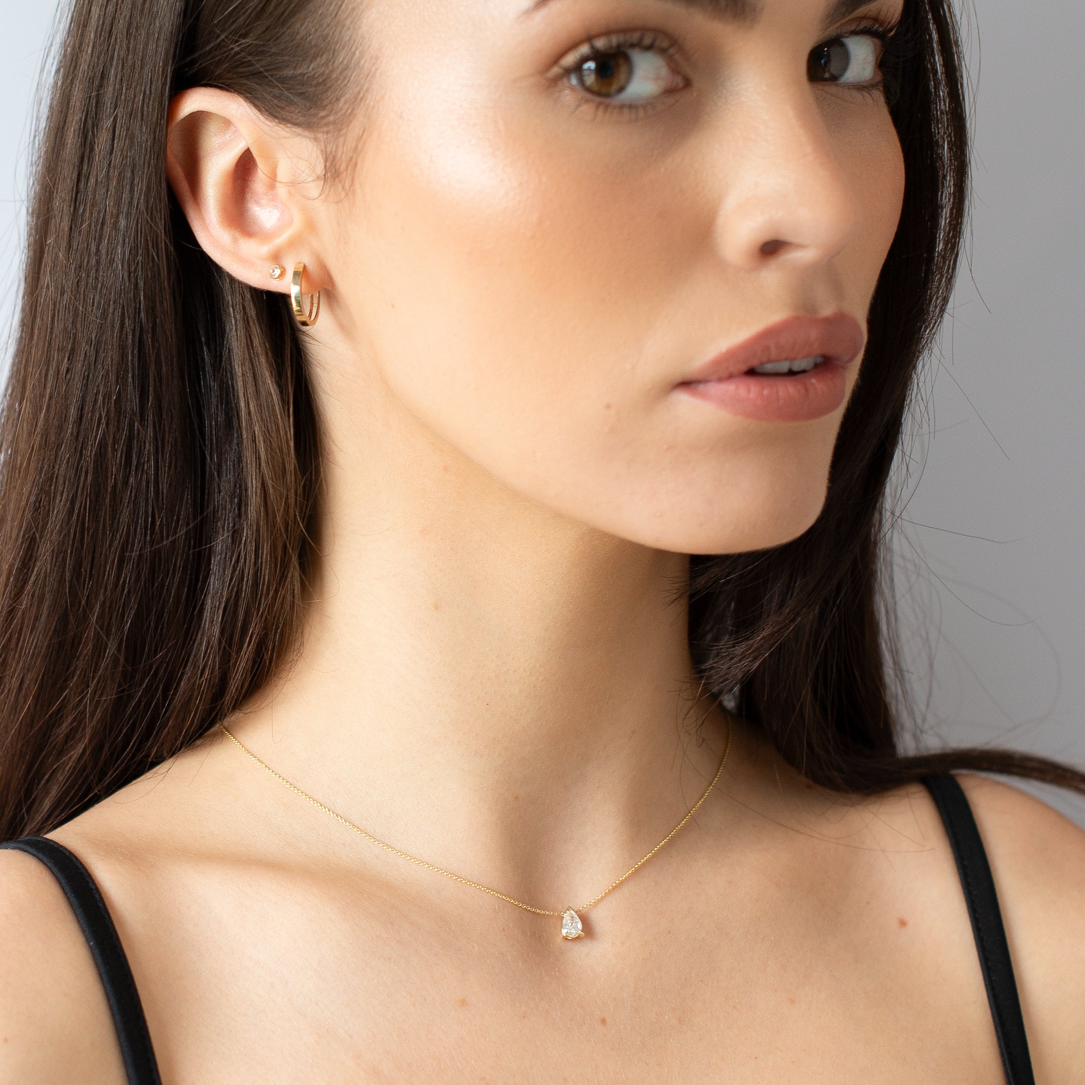 Gold Huggie Essential Earrings model shot