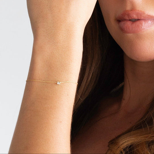 9Yw 0.11tdw round lab diamond claw set solitaire fine bracelet