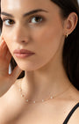 Gold Huggie Essential Earrings model shot