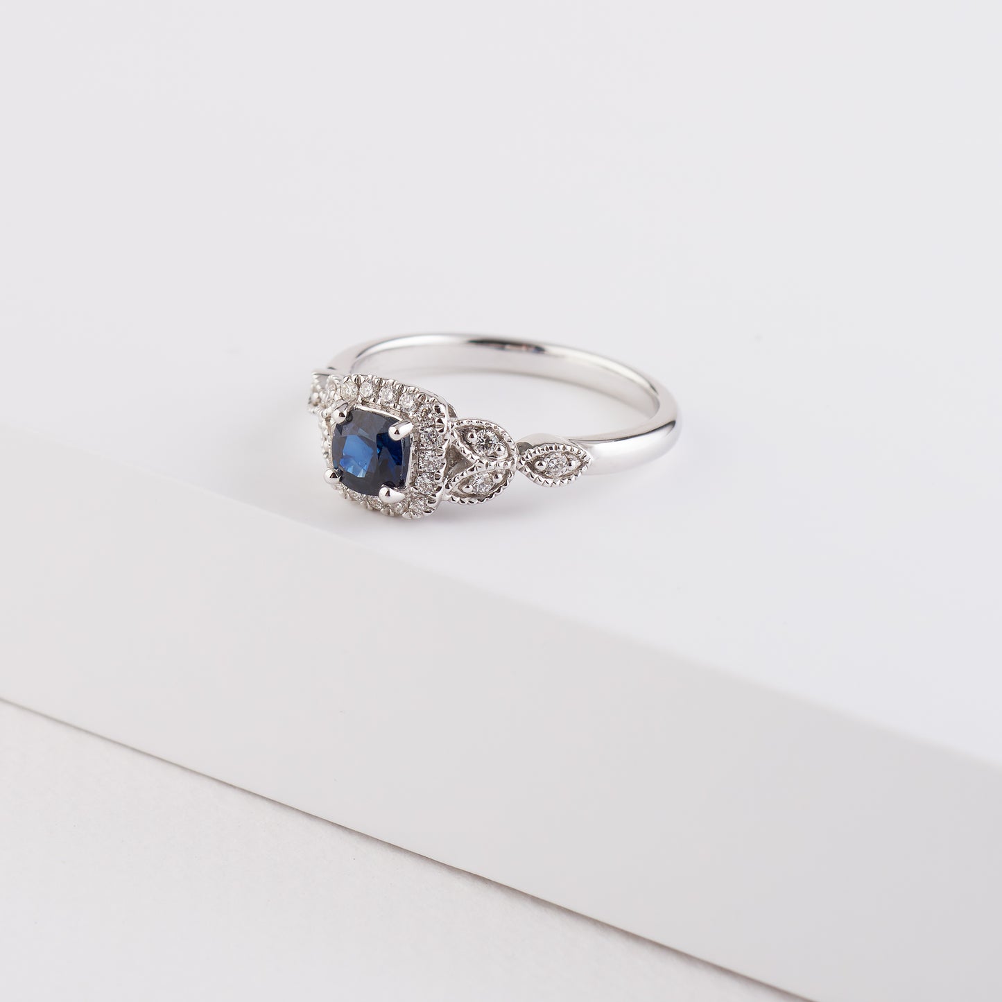 18K White Gold Ocean Blue Sapphire and Diamond Halo Ring.
