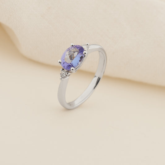 9K White Gold Sideways Oval Tanzanite and Diamond Trilogy Ring