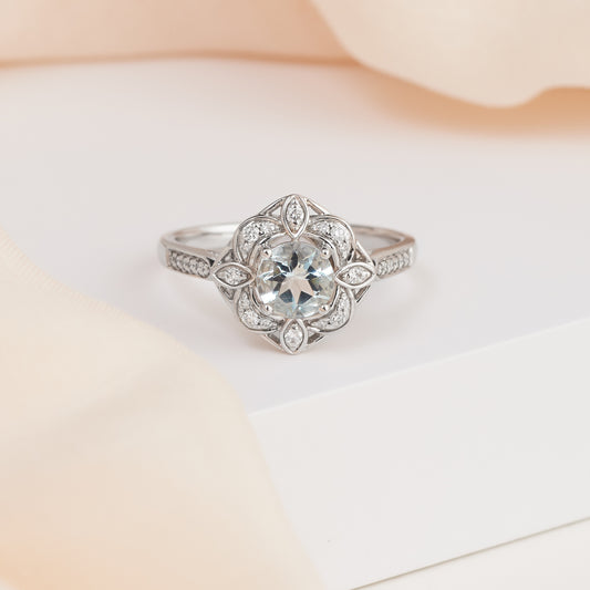 9K White Gold Aquamarine and Diamond Flower Halo Ring 0.15tdw