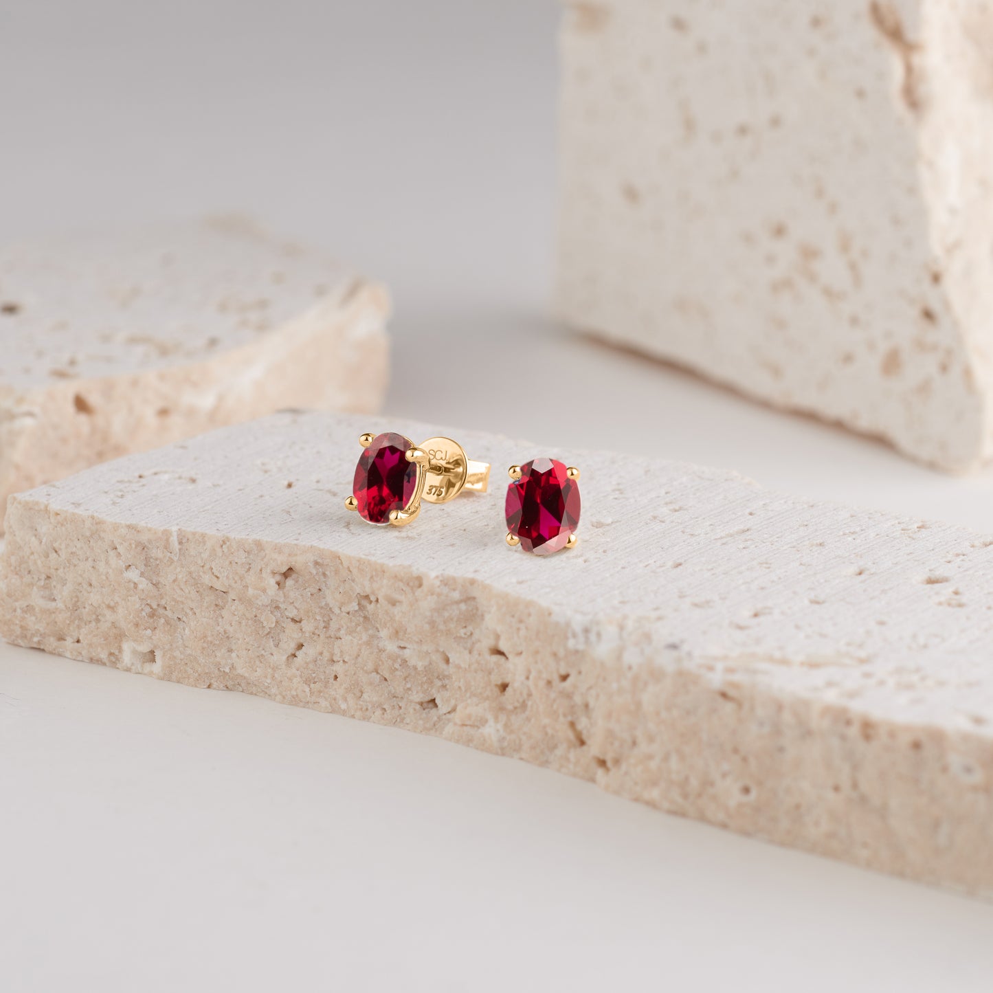 9K Yellow Gold Oval Created Ruby Classic Four Claw Stud Earrings